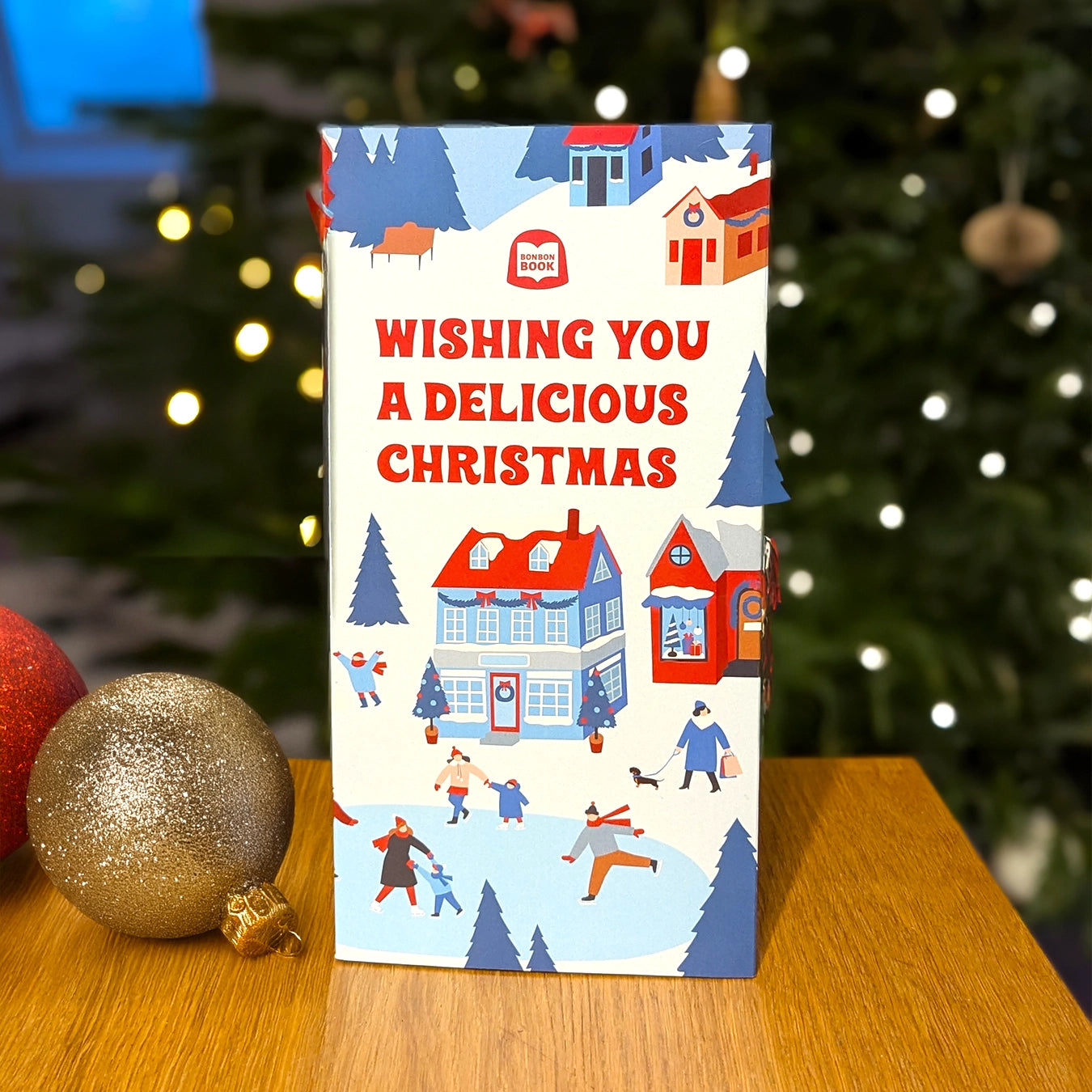 Kerstpakket: Bonbonbook + Kerstbal 23 bonbons